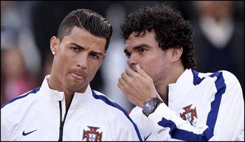 Pepe telling a secret to Cristiano Ronaldo