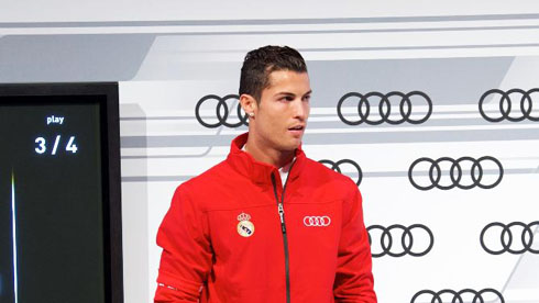 Cristiano Ronaldo wearing an Audi red uniform, in a promotional event