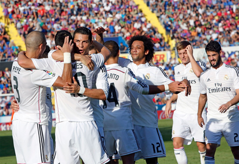 Real Madrid players celebrating a team goal