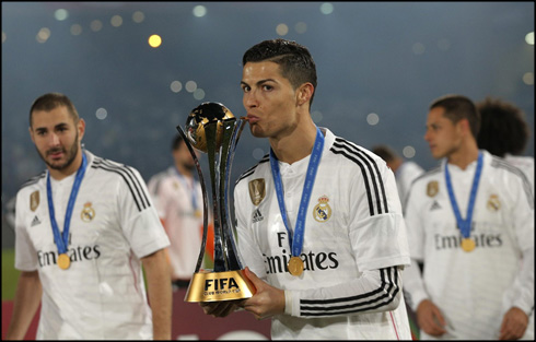 Cristiano Ronaldo kissing the FIFA Club World Cup trophy