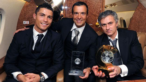 Jorge Mendes in the middle of Cristiano Ronaldo and José Mourinho