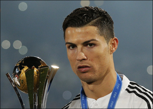 Cristiano Ronaldo holding the FIFA Club World Cup trophy