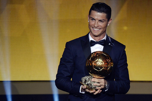 Cristiano Ronaldo visibly happy with his 3rd FIFA Ballon d'Or trophy