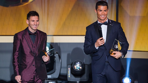 Messi and Cristiano Ronaldo smiling to the audiences, at the 2014 FIFA Ballon d'Or ceremony
