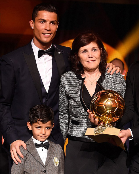 Cristiano Ronaldo with his mother and son, with the 2014 FIFA Ballon d'Or trophy