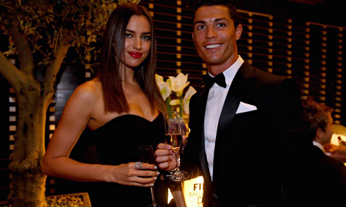 Cristiano Ronaldo and Irina Shayk toasting at a party