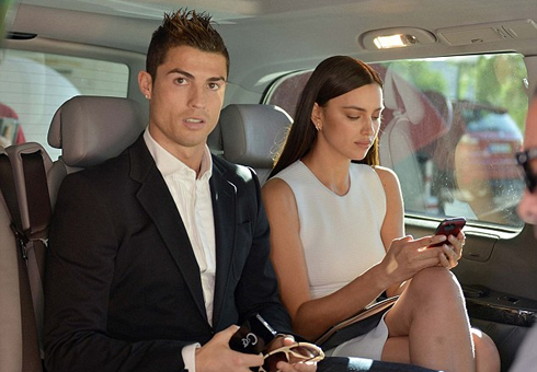 Cristiano Ronaldo and Irina Shayk using their mobile phones