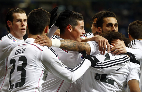 Real Madrid players celebrate a team goal in 2015