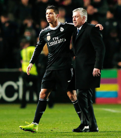 Cristiano Ronaldo and Carlo Ancelotti walking away from the pitch in Spain