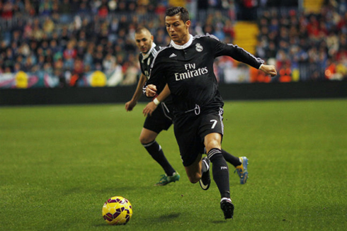 Cristiano Ronaldo playing in a black Real Madrid kit