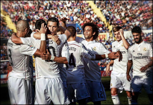 Real Madrid players in a goal celebration in 2015