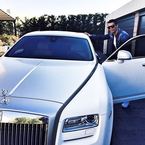 Cristiano Ronaldo with his new car, a Rolls Royce Ghost Phantom