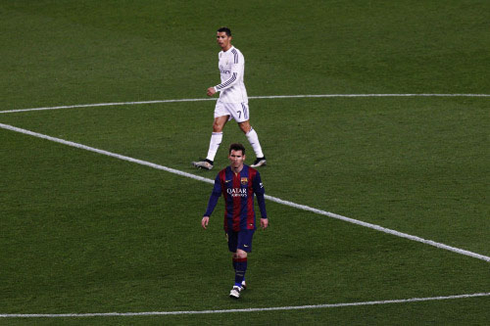 Lionel Messi and Cristiano Ronaldo alone in the center of the pitch