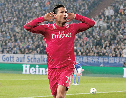 Cristiano Ronaldo celebrating Real Madrid goal in a pink uniform