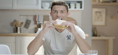 Cristiano Ronaldo eating a sandwich