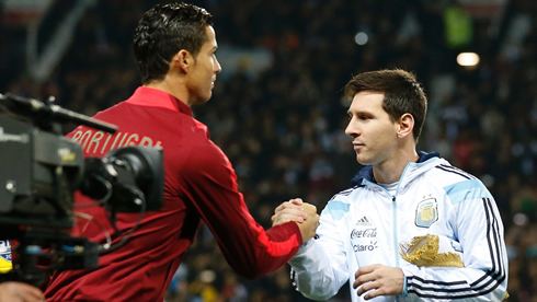 Cristiano Ronaldo shaking hands with Lionel Messi