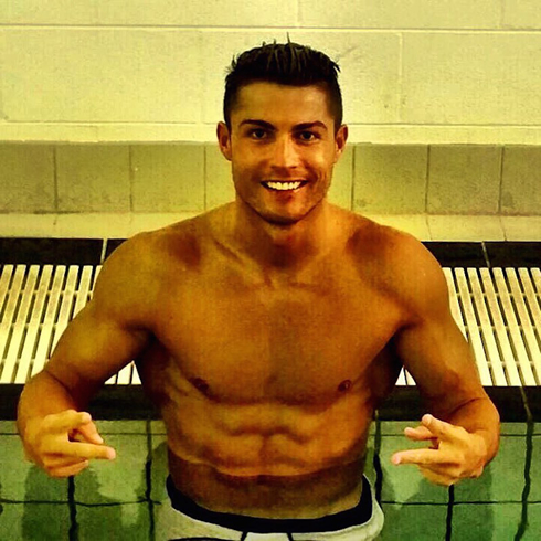 Cristiano Ronaldo shirtless and half naked, showing his abs in 2015