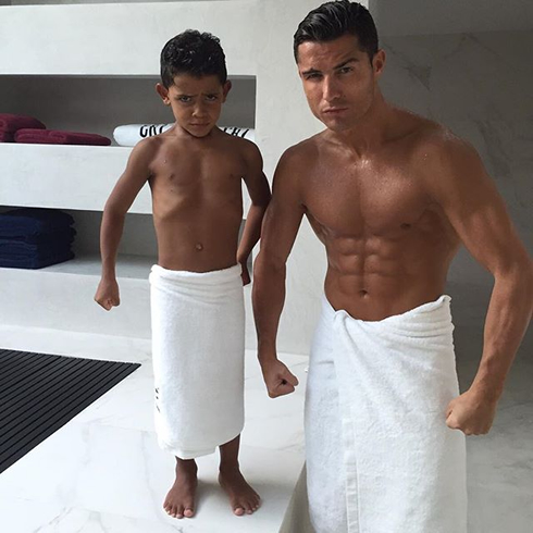 Cristiano Ronaldo and his son showing off their six-pack abs muscles