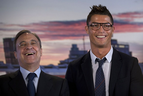Florentino Pérez next to Cristiano Ronaldo, both wearing reading glasses