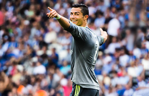 Cristiano Ronaldo looks behind smiling