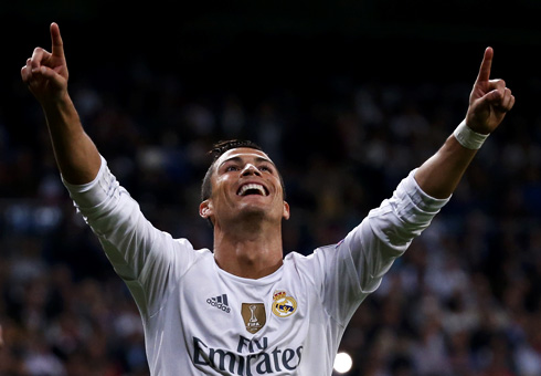 Cristiano Ronaldo holding his hands into the air after scoring for Real Madrid
