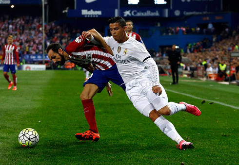 Cristiano Ronaldo trying to get past by Juanfran, in Atletico vs Real Madrid