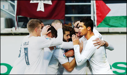 Cristiano Ronaldo and Real Madrid players group hug