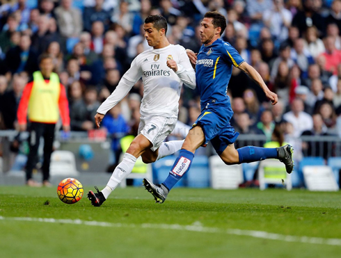 Cristiano Ronaldo prepares to strike the ball in full stride play