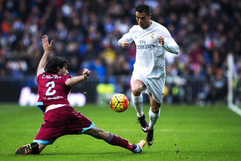 Cristiano Ronaldo dribbling an outstretched defender