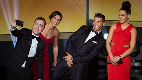 Cristiano Ronaldo on stage bending for a selfie, at the 2015 FIFA Ballon d'Or ceremony
