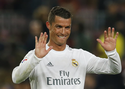 Cristiano Ronaldo raises his two hands and smiles, after Real Madrid 2-1 win against Barça