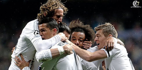 Real Madrid players gathering around Ronaldo to celebrate a goal in the Champions League in 2016