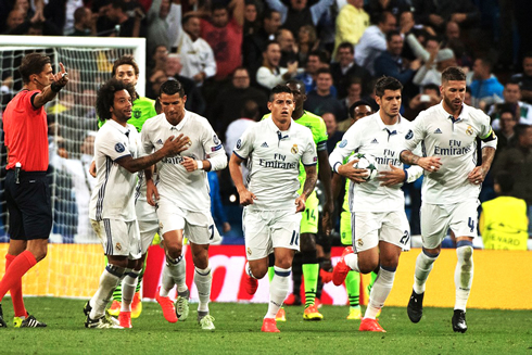 Real Madrid players tracking back to their half of the field after scoring the equalizer