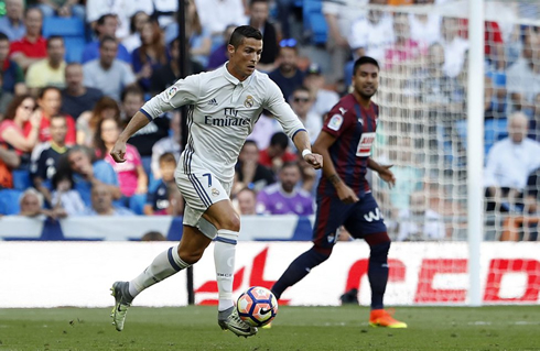 Cristiano Ronaldo running with the ball close to his foot