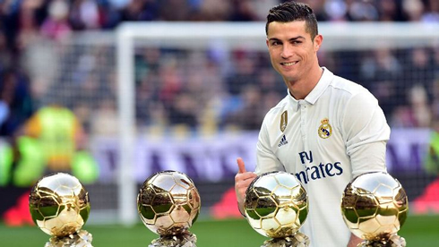 Cristiano Ronaldo showing his 4 Ballon d'Ors