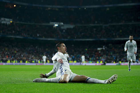 Cristiano Ronaldo celebrates his goal sliding on the ground