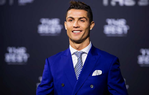 Cristiano Ronaldo suited up in a blue jacket