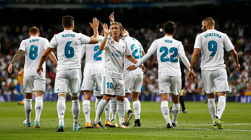 Real Madrid players celebrating a team goal