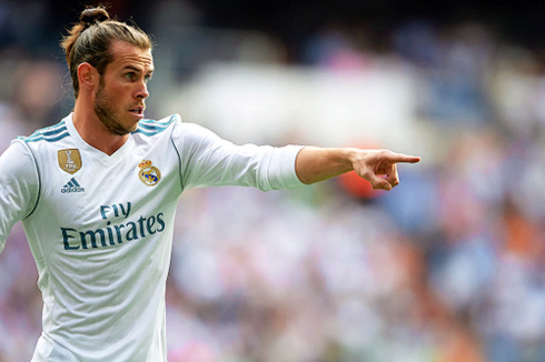 Gareth Bale pointing to his left in a game for Real Madrid