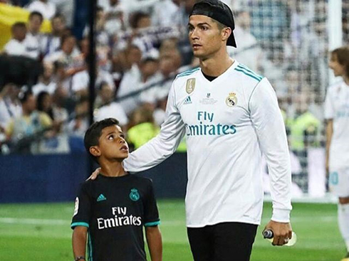 Cristiano Ronaldo walking side by side with his son after a Real Madrid game