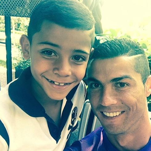 Cristiano Ronaldo son taking a selfie with his father