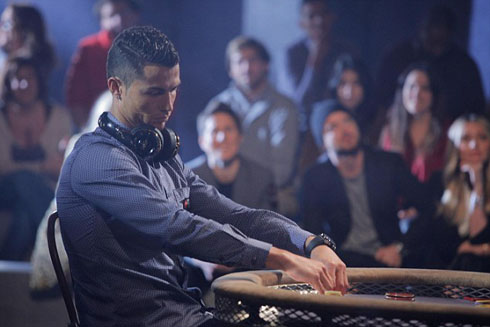 Ronaldo checking his card in a poker game
