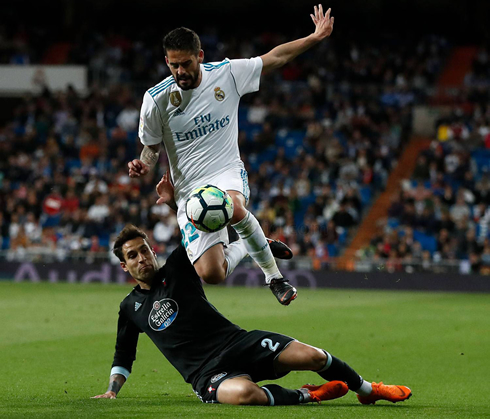 Isco jumping over a defender sliding tackle