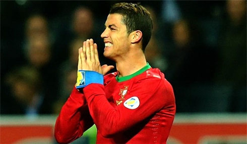 Cristiano Ronaldo prays in a game for Portugal