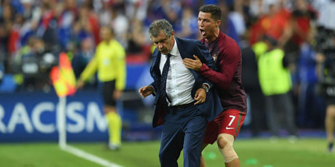 Cristiano Ronaldo jumping on the back of Fernando Santos in Euro 2016 final