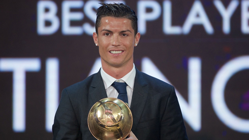 Cristiano Ronaldo holding trophy at the Globe Soccer Awards ceremony