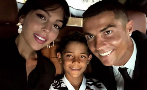 Georgina, Cristiano Jr and Cristiano Ronaldo taking a photo