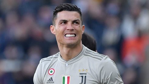 Cristiano Ronaldo in a grey Juventus shirt