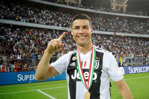 Cristiano Ronaldo with a medal won for Juventus around his neck