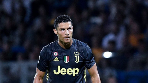 Cristiano Ronaldo playing in a Juventus black shirt